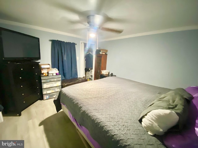 bedroom featuring ceiling fan and ornamental molding