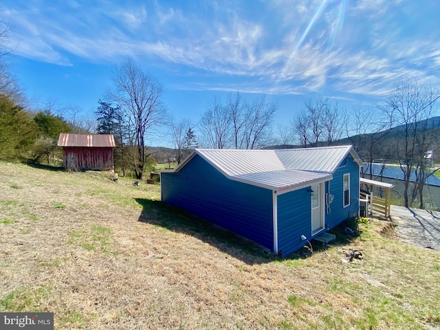 view of shed / structure with a lawn