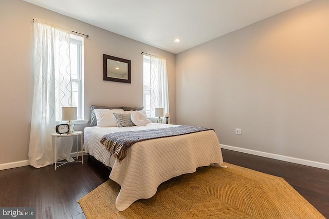 bedroom featuring dark hardwood / wood-style flooring