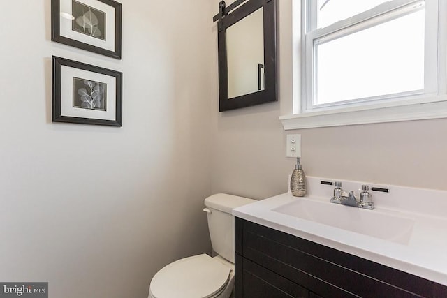 bathroom with toilet and vanity