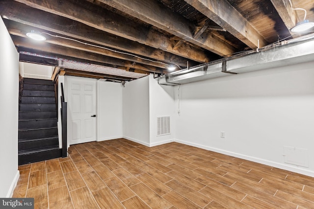 basement featuring hardwood / wood-style floors