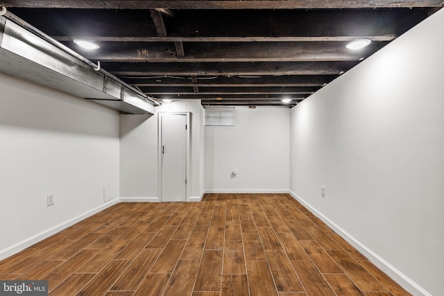 basement featuring hardwood / wood-style flooring