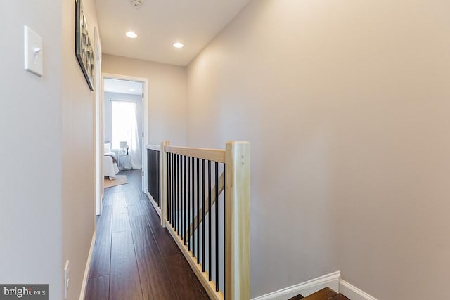 hall with dark hardwood / wood-style floors