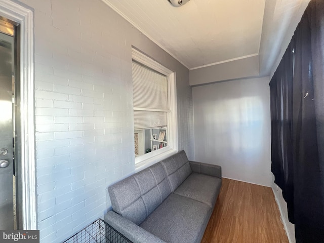 living room featuring ornamental molding and hardwood / wood-style flooring