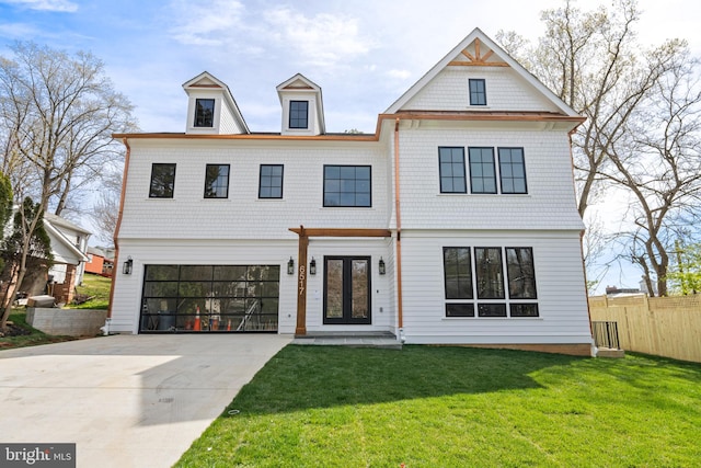 view of front facade with a front lawn and a garage