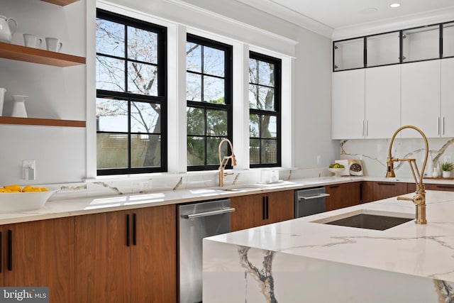 kitchen featuring white cabinetry, crown molding, light stone counters, and dishwasher