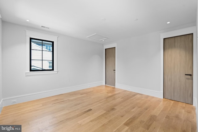 unfurnished room featuring light wood-type flooring