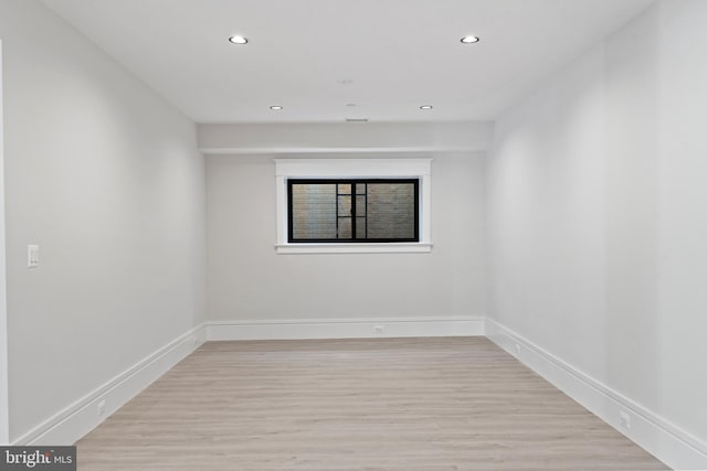 spare room with light hardwood / wood-style floors