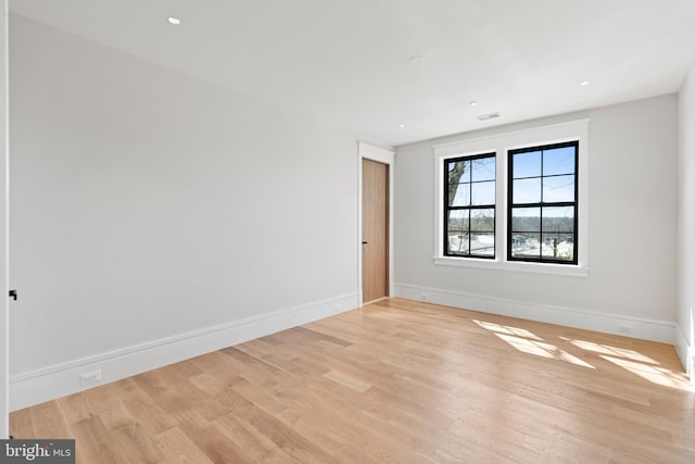 unfurnished room featuring light hardwood / wood-style flooring