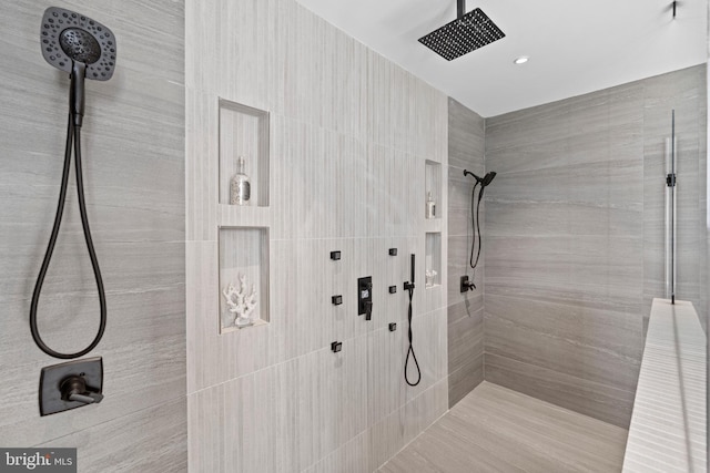 bathroom featuring tiled shower