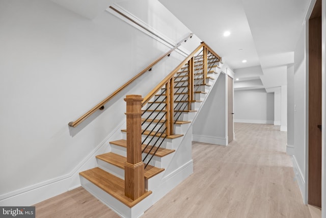 stairway featuring light hardwood / wood-style flooring