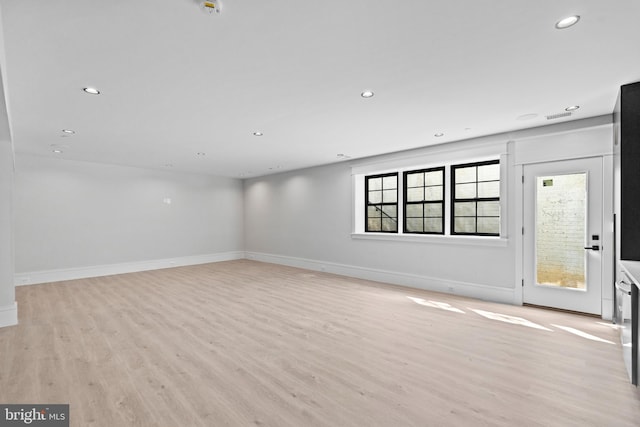 spare room featuring light wood-type flooring