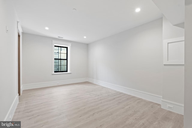 spare room featuring light wood-type flooring