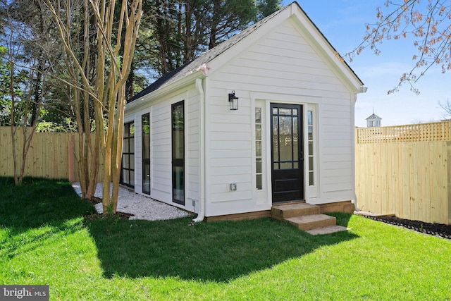 view of outdoor structure with a lawn