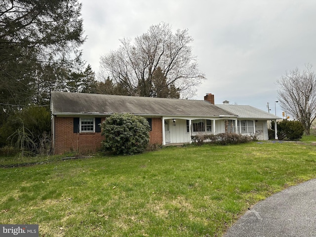 ranch-style house with a front lawn