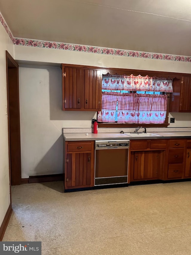 kitchen with dishwashing machine and sink