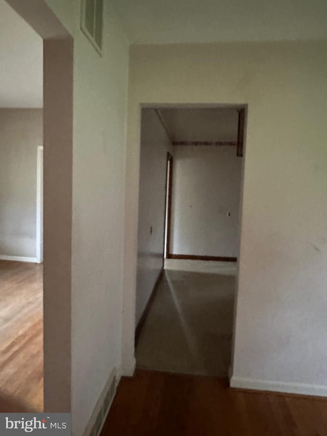 hallway featuring wood-type flooring