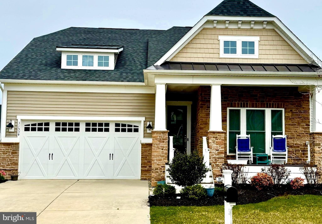 craftsman-style home featuring covered porch