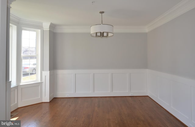 unfurnished room with dark wood-type flooring and crown molding