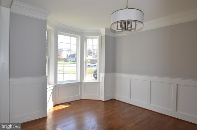 interior space featuring a notable chandelier, dark hardwood / wood-style floors, and ornamental molding