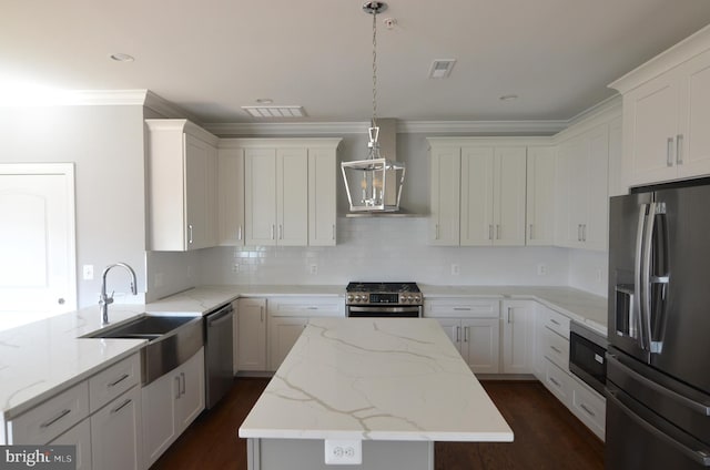 kitchen with tasteful backsplash, dark wood-type flooring, stainless steel appliances, white cabinetry, and light stone countertops