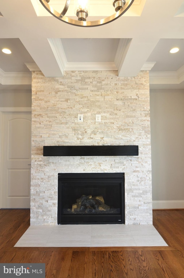 room details with dark hardwood / wood-style flooring, a fireplace, and ornamental molding