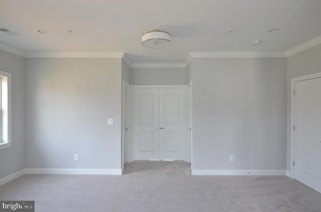 carpeted spare room with ornamental molding