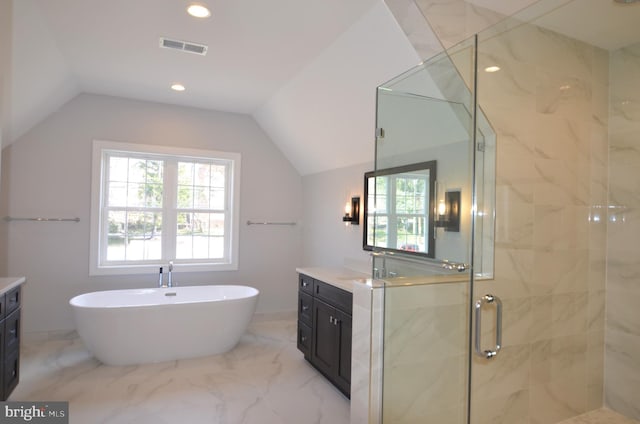 bathroom featuring tile floors, vanity, vaulted ceiling, and plus walk in shower