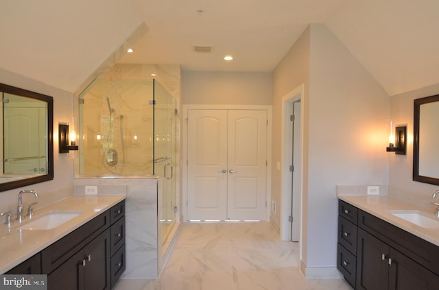 bathroom featuring walk in shower, double vanity, tile floors, and vaulted ceiling