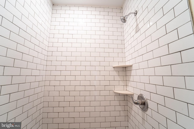 bathroom with tiled shower