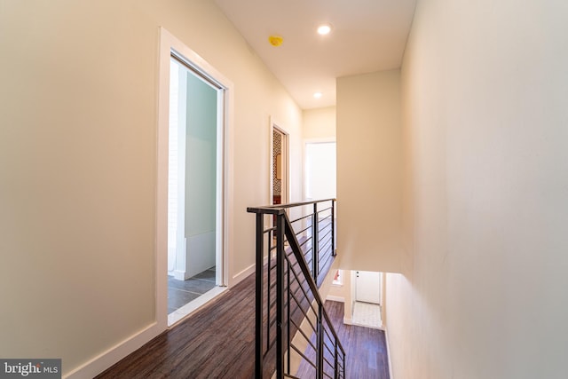 corridor with dark hardwood / wood-style floors