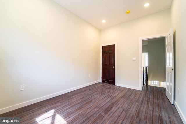 unfurnished bedroom with dark hardwood / wood-style floors