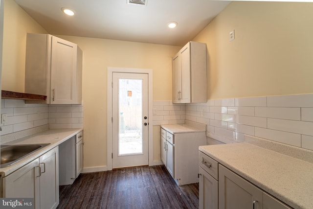 interior space with dark hardwood / wood-style floors and sink