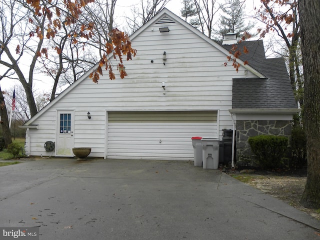 view of side of property with a garage