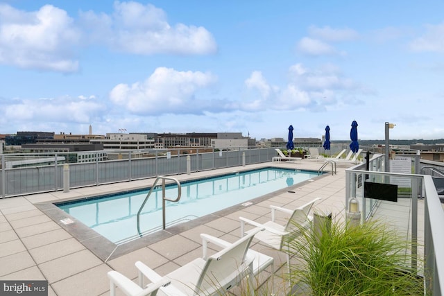 view of swimming pool featuring a patio