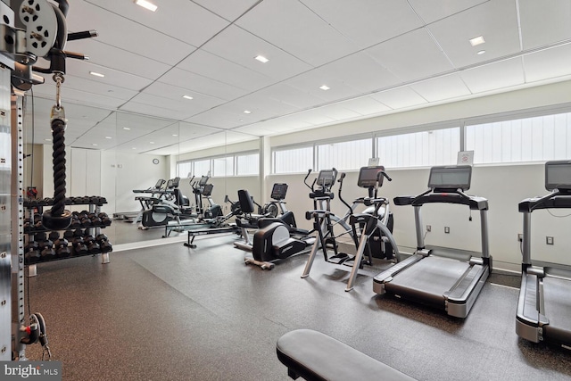 exercise room with a drop ceiling