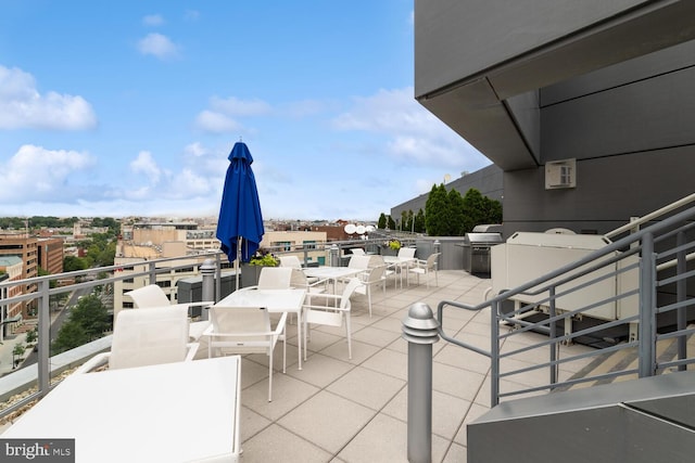 view of patio / terrace with a balcony and grilling area