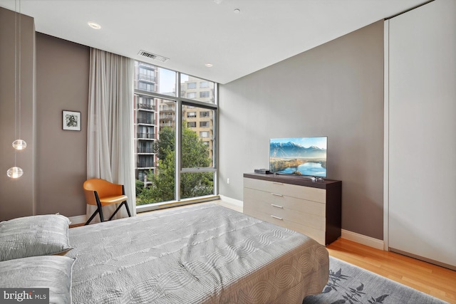 bedroom with light hardwood / wood-style flooring