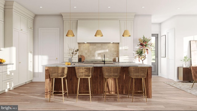 bar with a wealth of natural light, pendant lighting, backsplash, and light wood finished floors