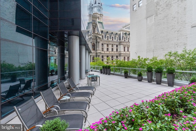 patio terrace at dusk with a balcony