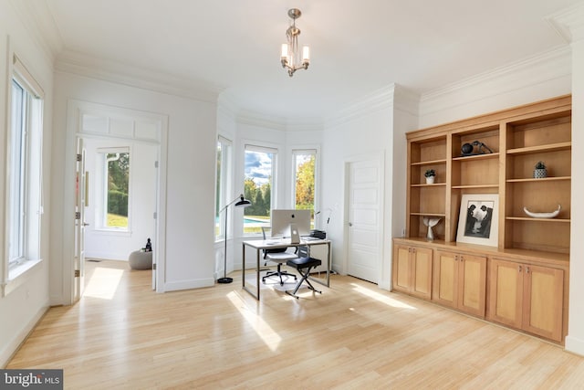 office space with an inviting chandelier, plenty of natural light, crown molding, and light hardwood / wood-style flooring