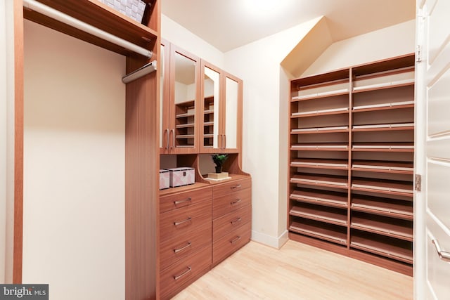 walk in closet featuring light hardwood / wood-style floors