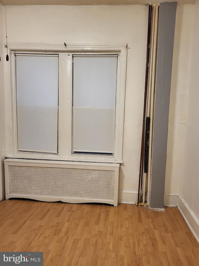 interior space featuring light hardwood / wood-style floors and radiator