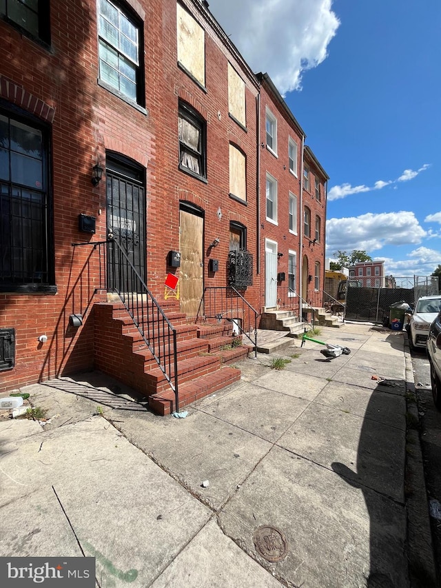 view of property with fence