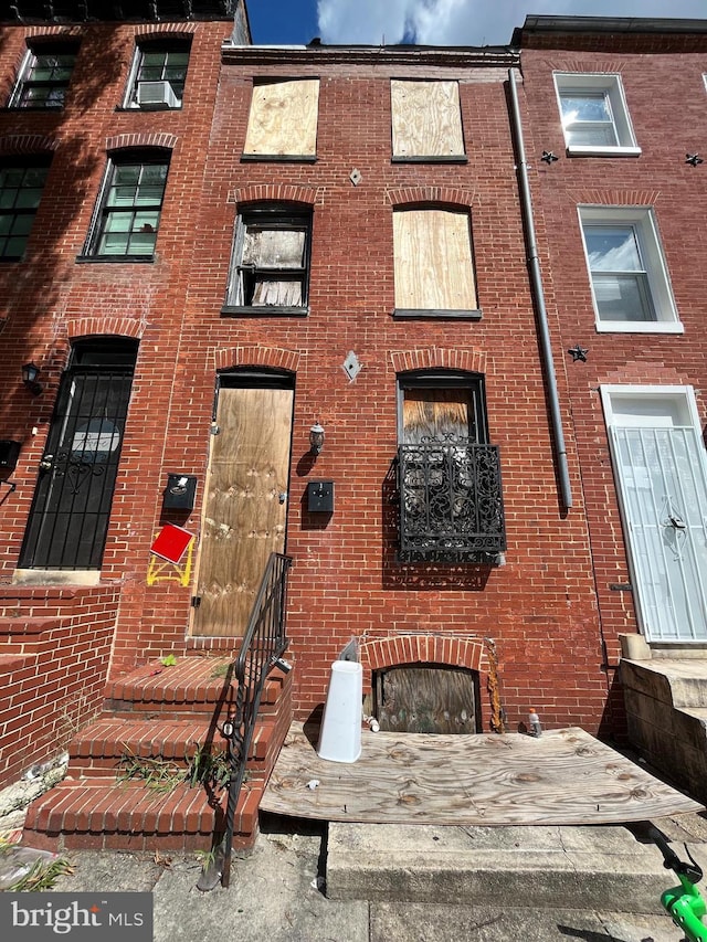 view of building exterior with entry steps