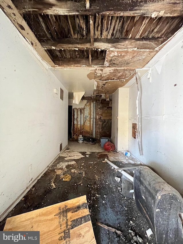 unfurnished living room with visible vents