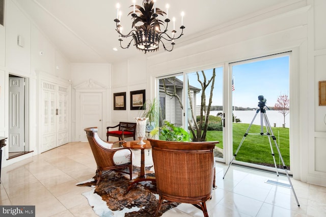 dining area with light tile patterned flooring, high vaulted ceiling, and an inviting chandelier