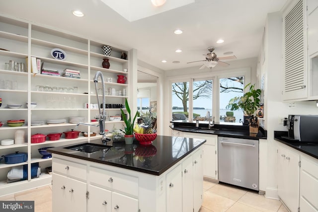 kitchen featuring a sink, dishwasher, white cabinets, and recessed lighting