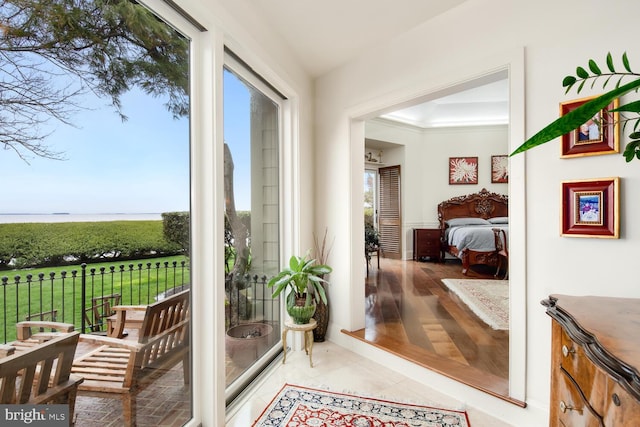 doorway to outside with light tile patterned floors