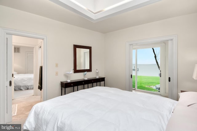 bedroom featuring visible vents and access to outside